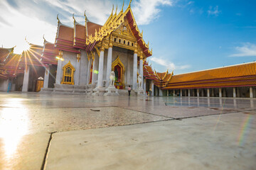 Fototapeta na wymiar Marble buddha temple with golden pagoda sightseeing travel in Bangkok city