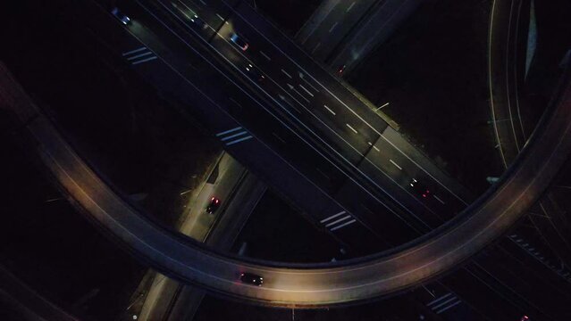 Car traffic transportation above a highway junction at night, captured in Cascais, Portugal