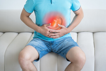 Stomach ulcer, man with abdominal pain suffering at home, symptoms of gastritis, diseases of the...