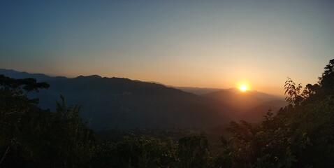 Fototapeta na wymiar Village mountain sunset sunrise clouds Nepal 