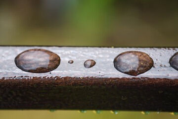 Drops on a painted metal part close-up macro