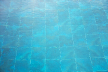 Abstract water background in the blue pool. Background on the theme of hotel relaxation with swimming pool.