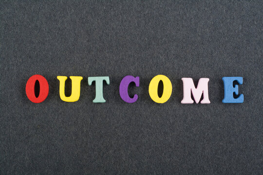 OUTCOME word on black board background composed from colorful abc alphabet block wooden letters, copy space for ad text. Learning english concept.