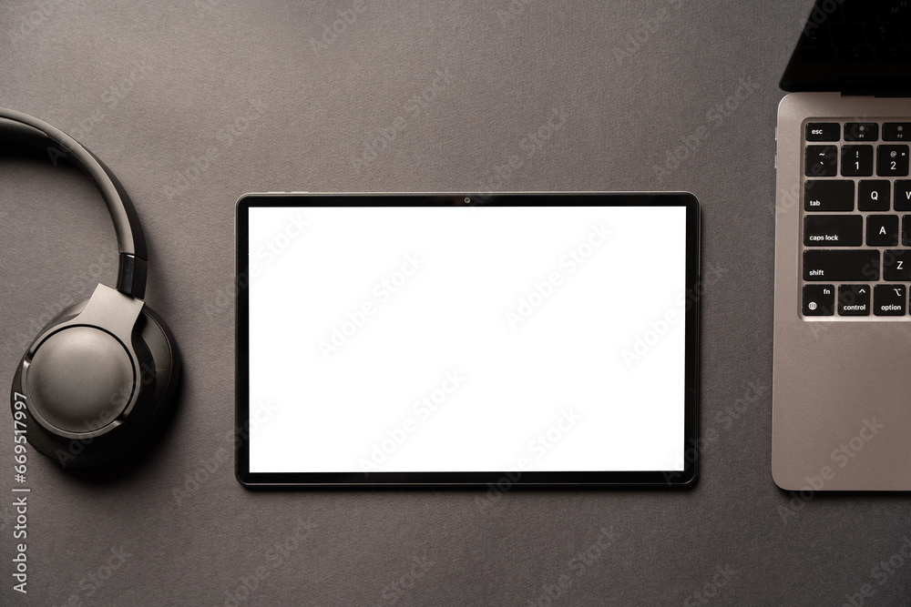Wall mural template of tablet computer with empty white mockup screen on the table. flat lay template for adver