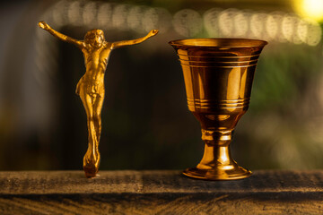 Eucharistic mass in the sacrament Eucharistic cup with Christian and religious cross.