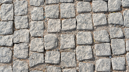 Stone pavement texture. Abstract background of cobblestone pavement