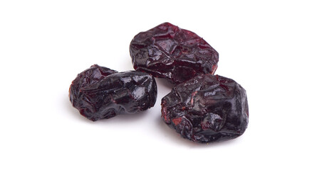 Dried black plums, prunes isolated on white background.