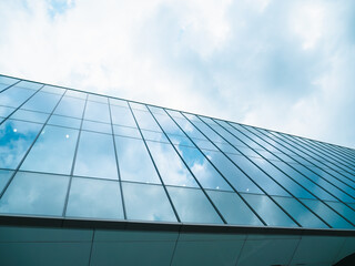 glass buildings with cloudy blue sky background, horizontal.