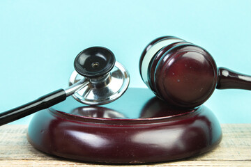 Judge gavel and stethoscope. The law in medicine, the sentence on medical negligence.