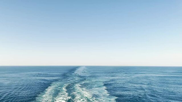 Mesmerising waves caused by boat motion through water view to the horizon