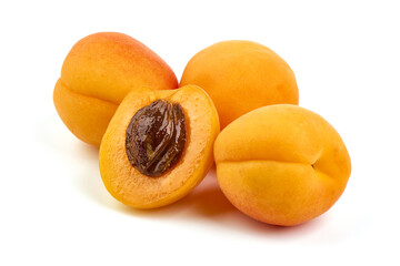 Isolated apricots. Fresh whole apricot fruit with half, isolated on white background.