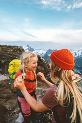 Family adventures Mother traveling with daughter child having fun outdoor hiking together active vacations in mountains 4 years old kid girl with backpack healthy lifestyle tour - obrazy, fototapety, plakaty