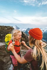 Foto op Plexiglas Family adventures Mother traveling with daughter child having fun outdoor hiking together active vacations in mountains 4 years old kid girl with backpack healthy lifestyle tour © EVERST