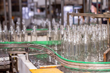 Glass factory, production of glass containers. Packaging of food containers. Robotics in industry. Modern technologies, robotic machines produce products. Technological work at the plant.