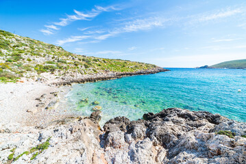 Beautiful beach and water bay in the greek spectacular coast line. Turquoise blue transparent water, unique rocky cliffs, Greece summer top travel destination, Peloponnese