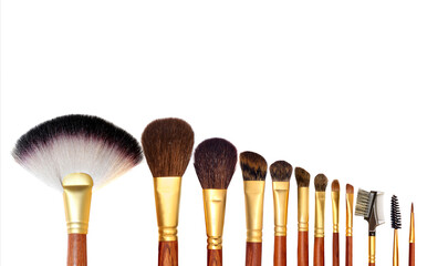 Flat lay composition with professional makeup brushes on white background