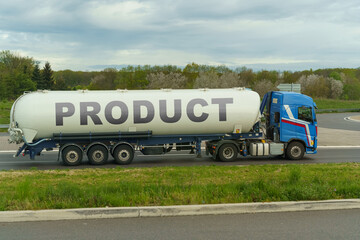On a tank truck driving along the road there is an inscription - Product