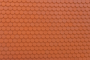 Orange texture of new plate tiles on the roof.