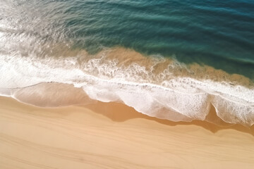 Aerial view of the beach, waves and sea.