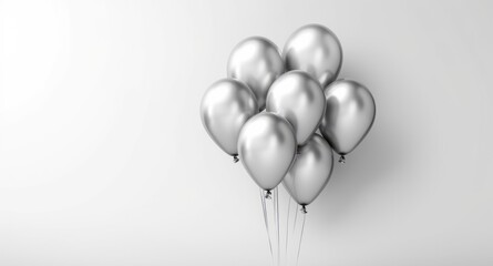 A bunch of silver balloons floating in the air