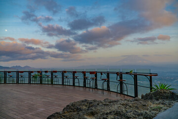 Outdoor table on Enam Langit restaurant with dramatic cloudy sky - Enam Langit, Borobudur, Indonesia