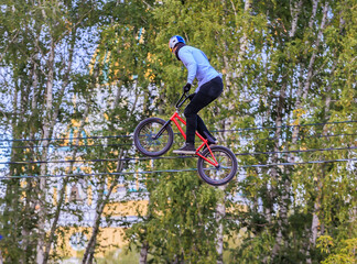 Fototapeta na wymiar Cyclist jumping on a bicycle