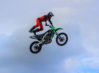 Moto freestyle jump rider on motorcycle