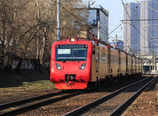 Electric train moves along the railway
