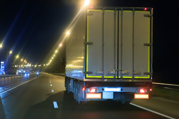 Truck moving at night along a country highway - 669584790