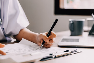 Medical technology concept. Doctor working with mobile phone and stethoscope in modern office