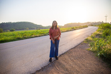 women asian standing on the countryside road