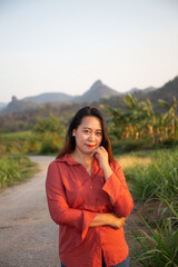 women asian standing on the countryside road