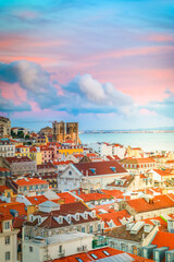 view of Lisbon over old town quarters with Se cathedral at sunset, Portugal