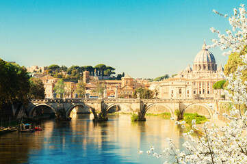 St. Peter's cathedral over bridge and river in Rome at spring, Italy