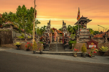 A Buddhist temple in the evening in the rain. The Brahmavihara-Arama temple has beautiful gardens and also houses a monastery. Tropical plants near Banjar, Bali