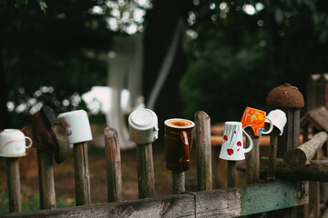 Tea and Coffee Cups on Wooden Fence as a Czech Tradition