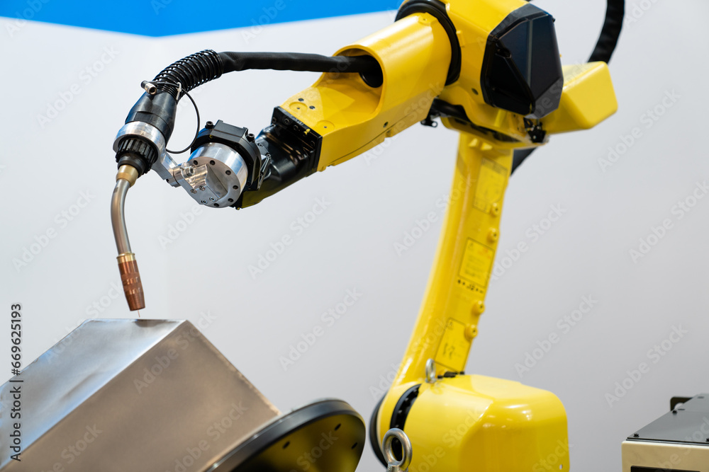 Poster Automatic welding robot in a modern factory in operation