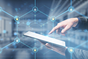 Close up of businessman hand pointing at cellphone with creative glowing hexagonal pattern with padlocks on blurry office interior background. Digital security and firewall concept. Double exposure.