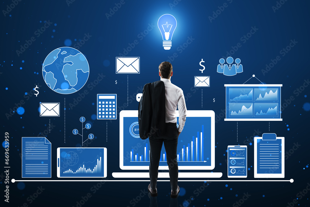 Aufkleber back view of young european businessman looking at financial data and accounting hologram with devic