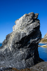 Dramatic uprising rock in a sunny arctic landscape, Gnalodden, Svalbard
