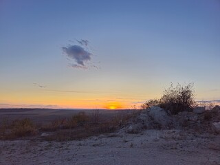 A snowy landscape with a sunset