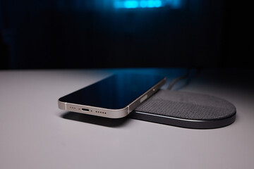 smartphone wireless charging on induction charger. Wireless charger