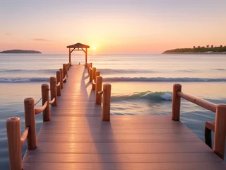 Foto op Canvas Wooden pier on the beach at beautiful sunset in the evening © Евгений Порохин