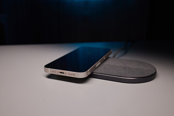 smartphone wireless charging on induction charger. Wireless charger