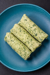 Delicious fresh pancakes with spinach, cream cheese, salmon, salt and spices