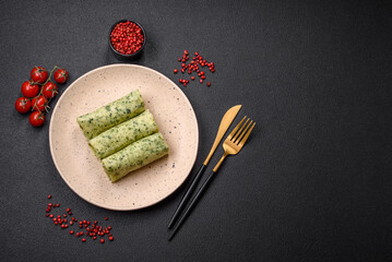 Delicious fresh pancakes with spinach, cream cheese, salmon, salt and spices