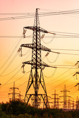 A Majestic Tower Standing Tall Amidst a Network of Electrical Wires. A large tower with many power lines above it