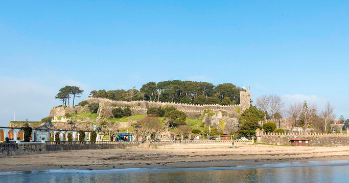 Fortified castle by the sea, castle with wall and forest on the coast, Parador de Baiona, Galicia, Spain - Powered by Adobe