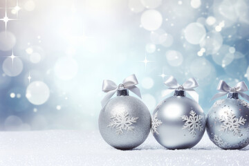 Silver christmas balls with brown ornaments and bows on glitter bokeh backdrop. Christmas holiday...