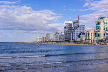 The view of Tel Aviv Bugrashov sandy beach with the Mediterranean sea coastline, and resort hotels...